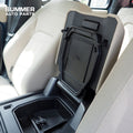 Side view of installed armrest cover privacy storage box in Land Rover Defender L663 cabin