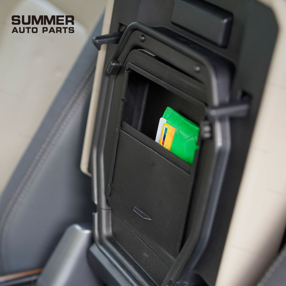 Open armrest cover privacy storage box in Land Rover Defender L663 holding wallet and cards