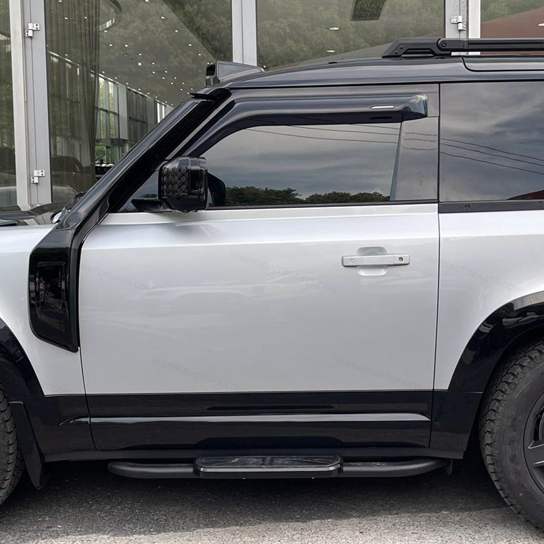 Side view of black Union Jack side steps installed on Land Rover Defender 90 L663