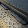 Close-up of black Union Jack side steps installed on Land Rover Defender L663