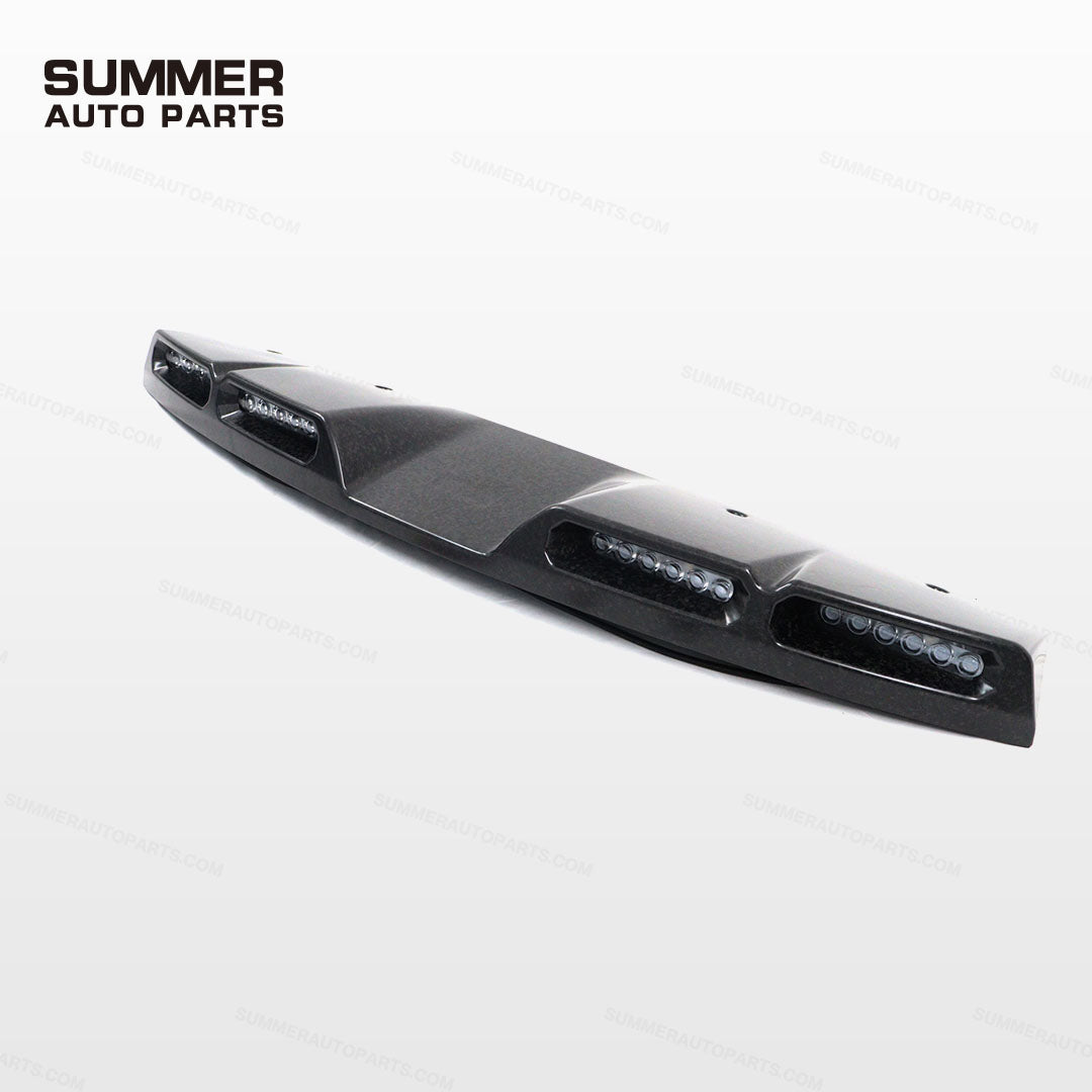 Angled front view of forged carbon fiber roof light bar with four LED pods for Defender L663
