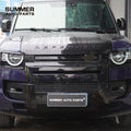 Installed front view of 007 style gloss black bumper kit on Land Rover Defender 90 L663