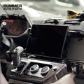 Close-up of OEM 11.4-inch infotainment screen installation in Land Rover Defender L663