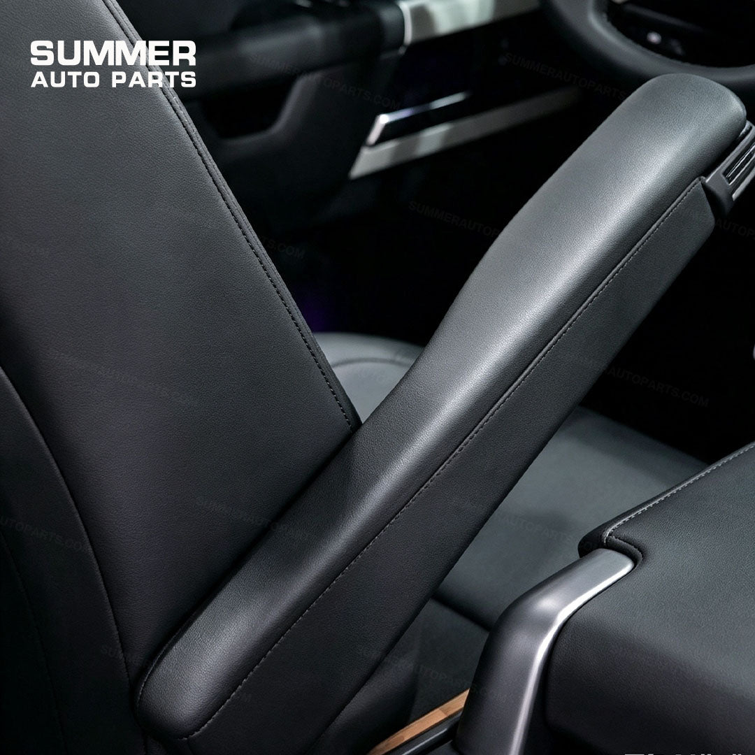 Detail view of black front seat armrest installed on Land Rover Defender L663