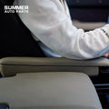 Side view of khaki front seat armrest installed on Land Rover Defender L663
