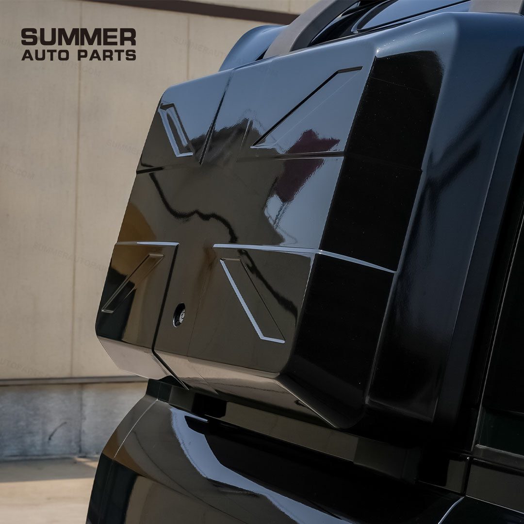 Close-up of gloss black Union Jack side storage box installed on Land Rover Defender L663