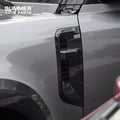 Angled view of silver edge Union Jack side steps for Land Rover Defender 110 L663