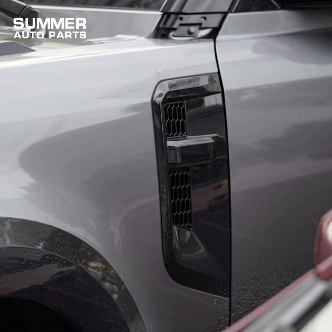 Angled view of silver edge Union Jack side steps for Land Rover Defender 110 L663
