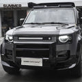 Side view of black Union Jack side steps installed on Land Rover Defender 90 L663
