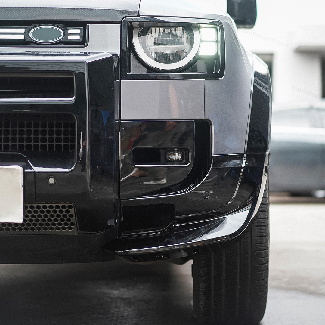 Close-up of black Union Jack side steps installed on Land Rover Defender L663