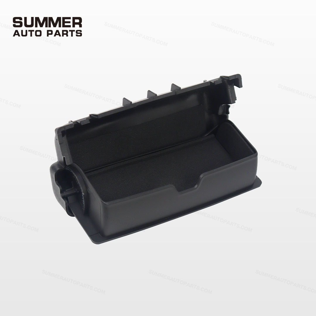 Open black overhead sunglasses holder for Land Rover Defender L663 showing storage compartment