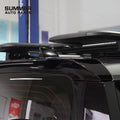 Installed side view of gloss black rear roof spoiler on Land Rover Defender L663