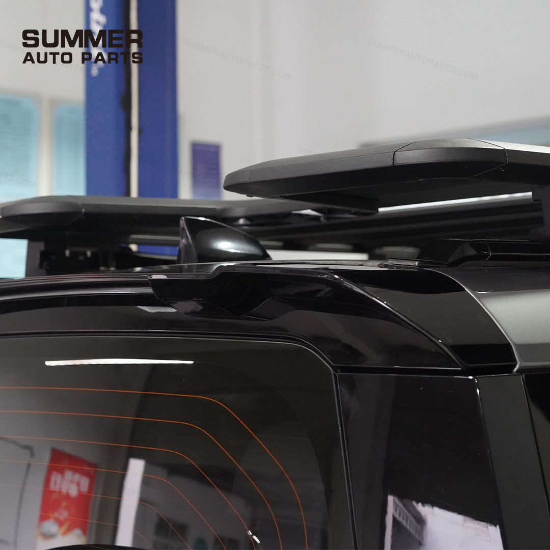 Installed side view of gloss black rear roof spoiler on Land Rover Defender L663