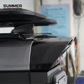 Installed rear corner view of gloss black roof spoiler on Land Rover Defender L663