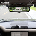 Installed ClearSight rearview mirror showing rear camera display in Land Rover Defender L663 cabin
