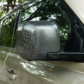 Close-up of forged carbon side mirror cover installed on Land Rover Defender L663