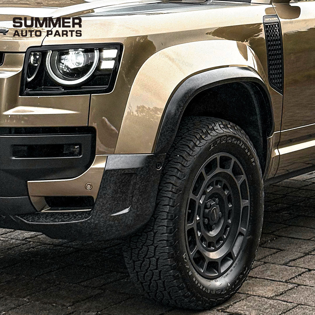 Front wheel view of OCTA style satin carbon wheel arches installed on Land Rover Defender L663