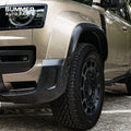 Close-up of OCTA style satin carbon wheel arch installed on Land Rover Defender L663